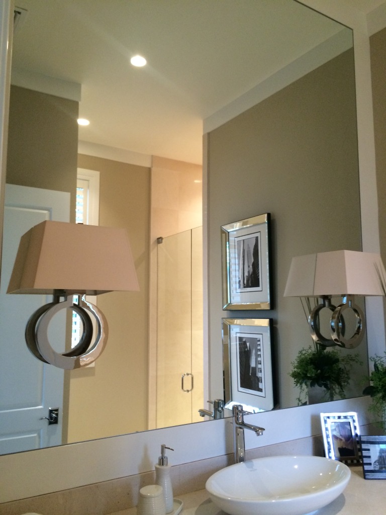 double sconce mounted on mirror
