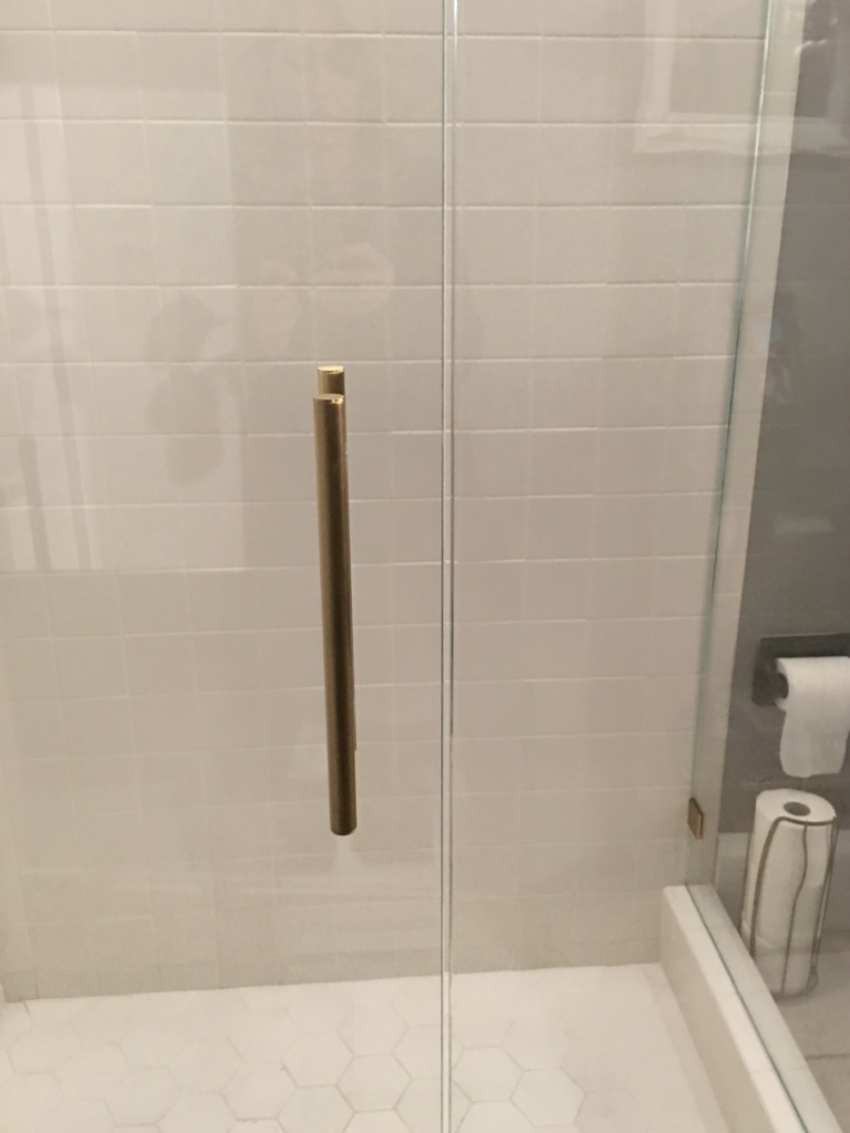 ultra clear glass shower door with white tile